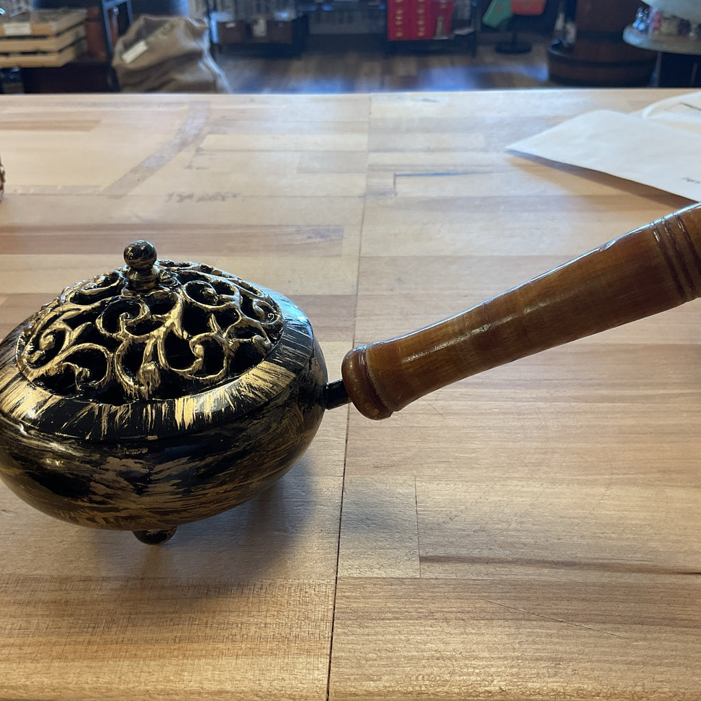 Antique style brass incense burner featuring a smooth wooden handle